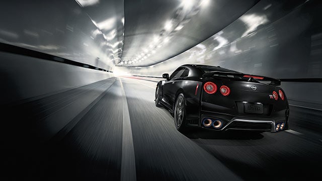 2023 Nissan GT-R seen from behind driving through a tunnel | Pischke Motors Nissan in La Crosse WI